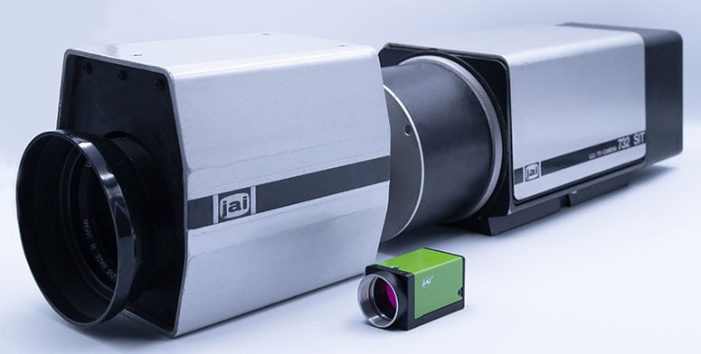 JAI first industrial camera next to JAI modern small size machine vision camera